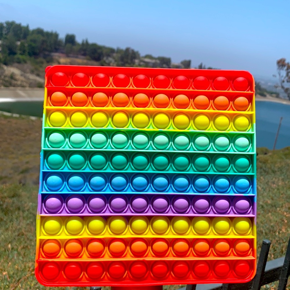 Rainbow pop it also a pop it keychain
